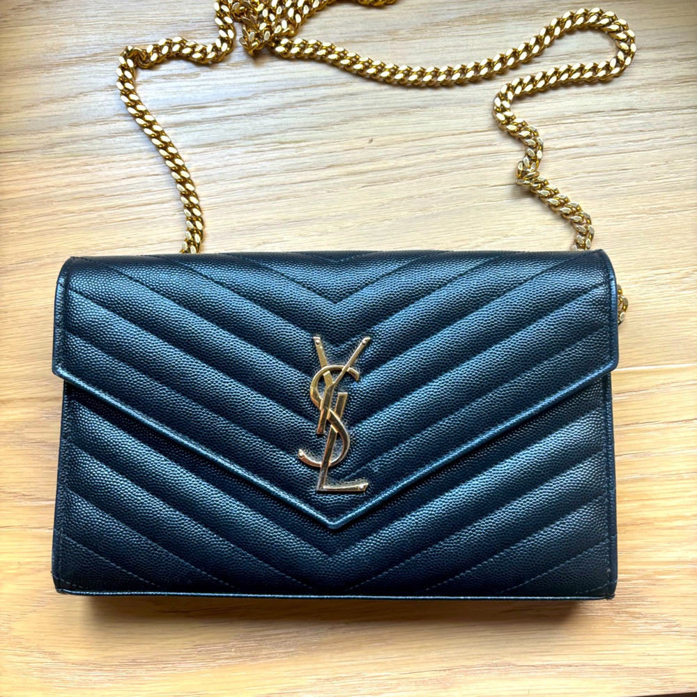 Saint Laurent (YSL) black crossbody with gold chain detail